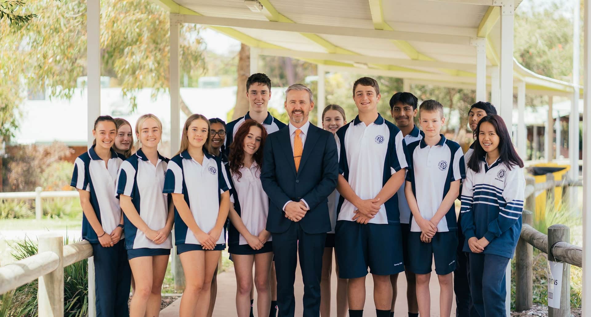 Duncraig Senior High School Principal, Peter Lillywhite stands with a group of students.